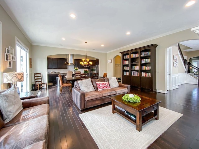 220 S Castell Ave, Rochester, MI 48307 - living area with arched walkways, a chandelier, dark wood-style flooring, plenty of natural light, and recessed lighting