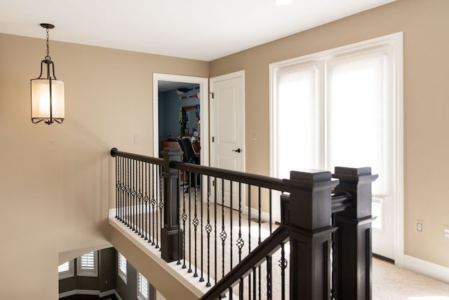 220 S Castell Ave, Rochester, MI 48307 - hall featuring an upstairs landing, baseboards, and light colored carpet