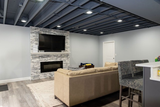 220 S Castell Ave, Rochester, MI 48307 - living room featuring wood finished floors, a fireplace, and baseboards