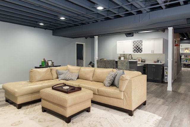 220 S Castell Ave, Rochester, MI 48307 - living room with wet bar, light wood-style floors, and wine cooler