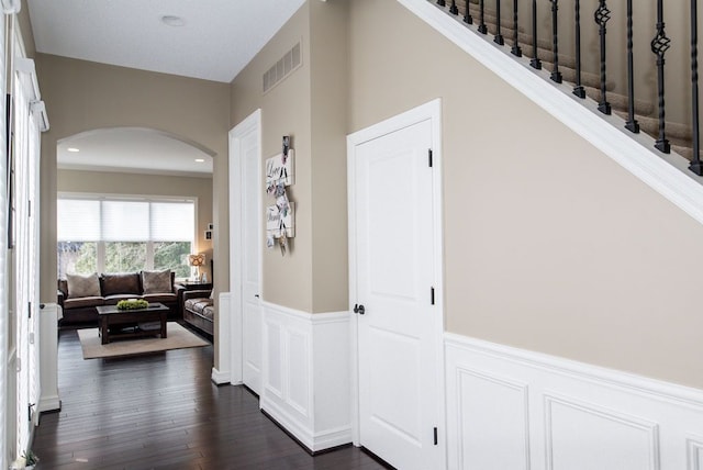 220 S Castell Ave, Rochester, MI 48307 - corridor with arched walkways, wainscoting, dark wood-type flooring, a decorative wall, and recessed lighting