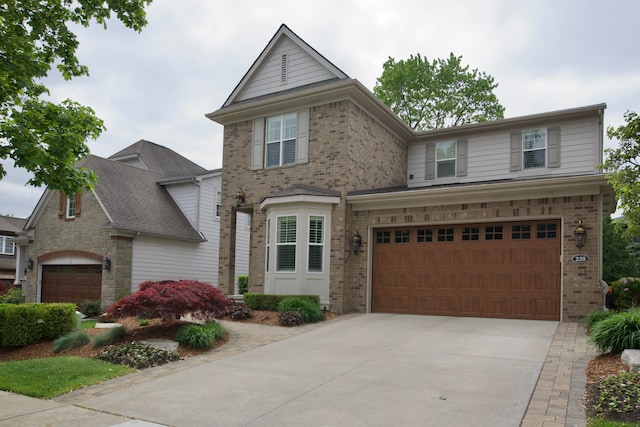 220 S Castell Ave, Rochester, MI 48307 - traditional-style house with brick siding, an attached garage, and driveway