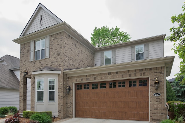 220 S Castell Ave, Rochester, MI 48307 - traditional-style house featuring brick siding, a garage, and concrete driveway