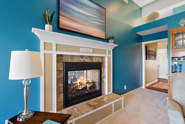 4144 Ridge Rd Unit 16, Stevensville, MI 49127 - detailed view of carpet flooring, a fireplace, and baseboards