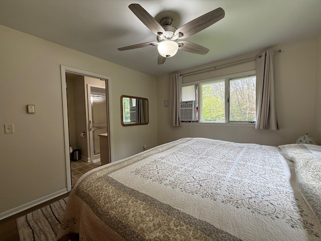 7298 W M-116, Ludington, MI 49431 - bedroom featuring baseboards, a ceiling fan, cooling unit, and ensuite bath