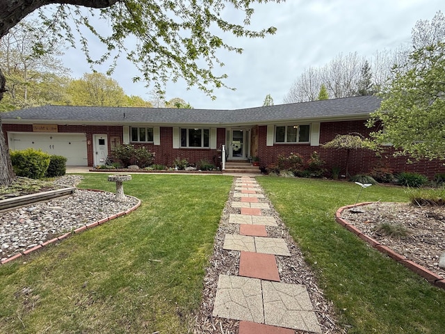 7298 W M-116, Ludington, MI 49431 - ranch-style home with brick siding, an attached garage, and a front yard