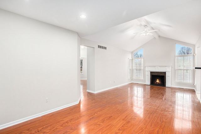 50128 Bethesda, Shelby Twp, MI 48317 - unfurnished living room with baseboards, visible vents, light wood-style floors, and a ceiling fan