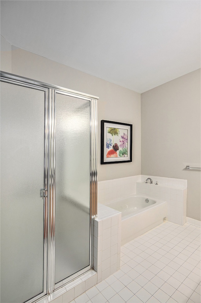 50128 Bethesda, Shelby Twp, MI 48317 - full bath featuring tile patterned flooring, a stall shower, and a bath