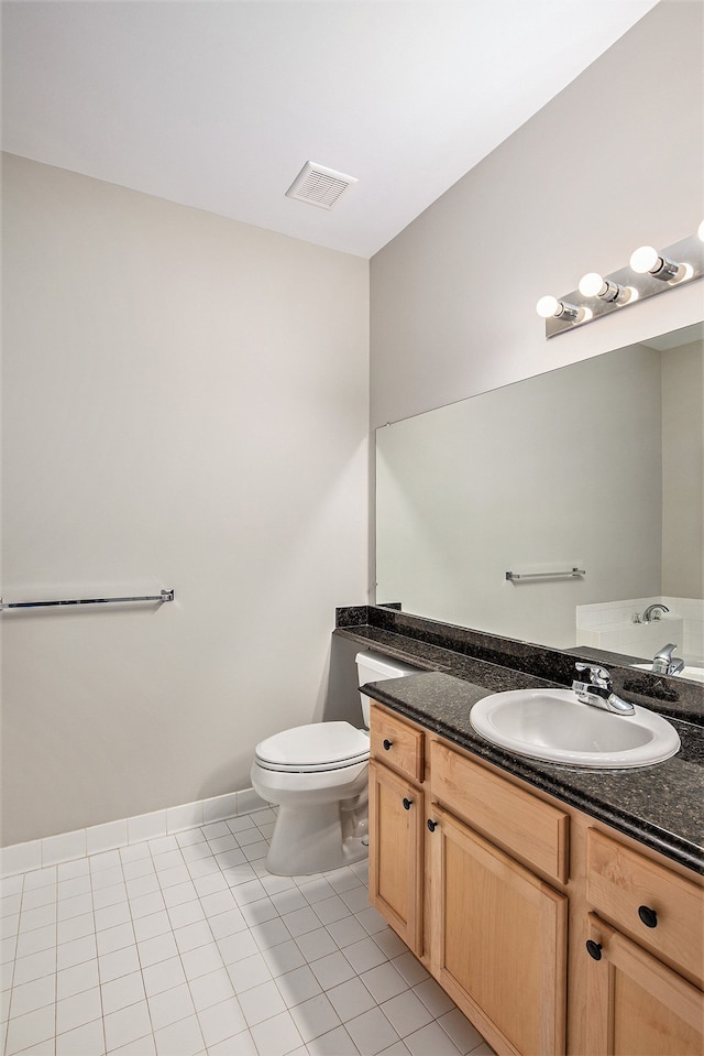 50128 Bethesda, Shelby Twp, MI 48317 - bathroom featuring visible vents, baseboards, toilet, vanity, and tile patterned flooring