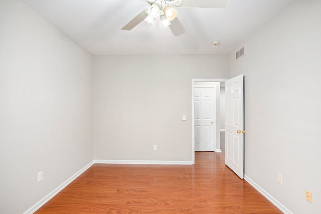 50128 Bethesda, Shelby Twp, MI 48317 - spare room featuring a ceiling fan, baseboards, light wood-style floors, and visible vents