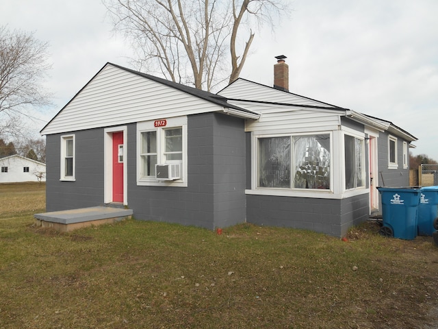 5972 Birch Run Rd, Millington, MI 48746 - view of front of home with a chimney, cooling unit, and a front lawn