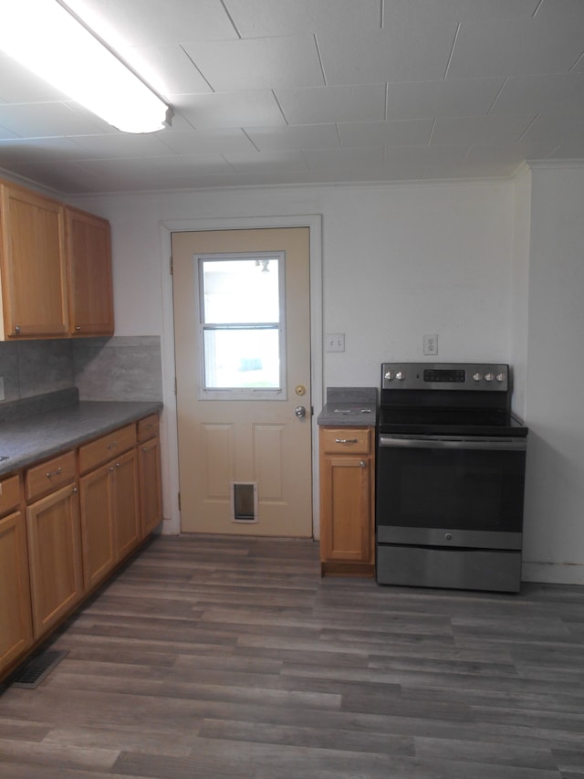 5972 Birch Run Rd, Millington, MI 48746 - kitchen featuring backsplash, visible vents, dark countertops, stainless steel range with electric cooktop, and dark wood-style floors