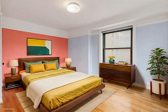 15 E Kirby St Unit 229, Detroit, MI 48202 - bedroom with light wood-style floors and baseboards