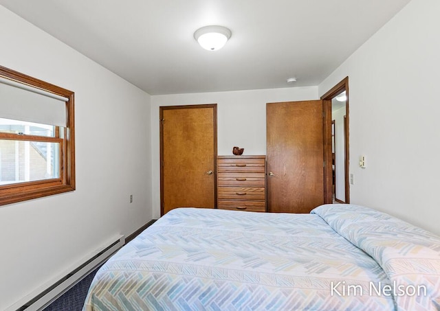 6195 Murray Rd, Whitehall, MI 49461 - bedroom featuring baseboard heating and baseboards