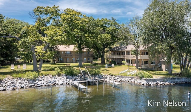 6195 Murray Rd, Whitehall, MI 49461 - dock area with a water view, a lawn, and stairs