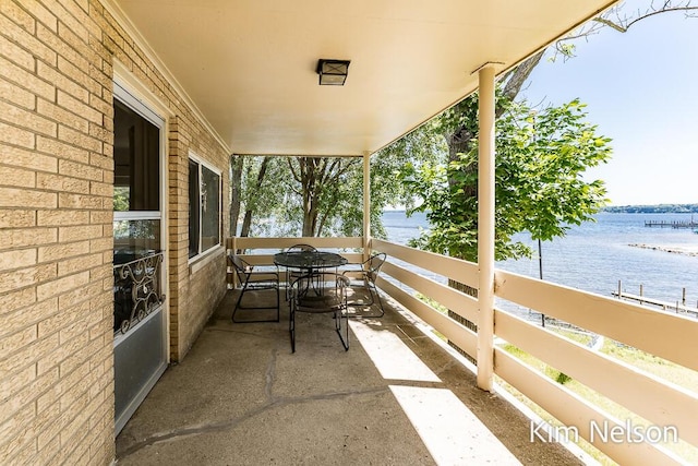 6195 Murray Rd, Whitehall, MI 49461 - view of patio / terrace with a balcony and a water view