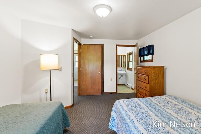 6195 Murray Rd, Whitehall, MI 49461 - bedroom with connected bathroom, baseboards, baseboard heating, and carpet floors