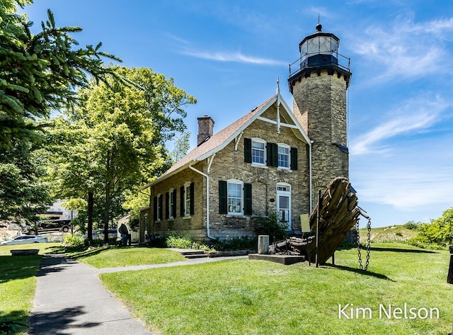 6195 Murray Rd, Whitehall, MI 49461 - view of front of house with a chimney and a front yard