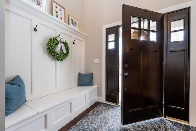 mudroom with dark wood-style floors