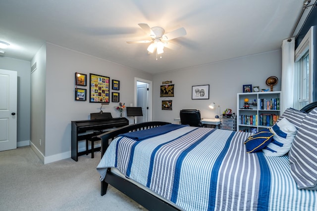 bedroom featuring light carpet, a ceiling fan, and baseboards