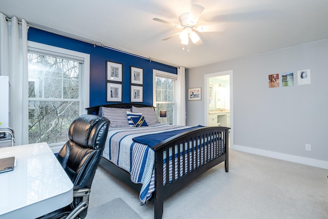 bedroom featuring carpet flooring, a ceiling fan, baseboards, and connected bathroom