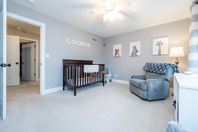 bedroom with visible vents, baseboards, and light colored carpet