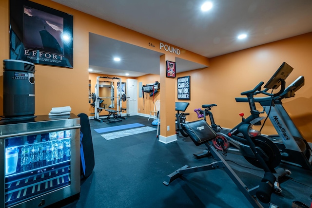 gym featuring recessed lighting and baseboards