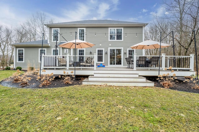 rear view of house with a lawn