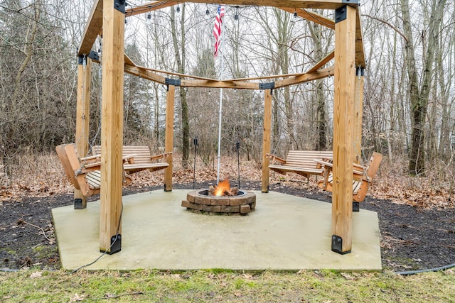 view of patio featuring an outdoor fire pit