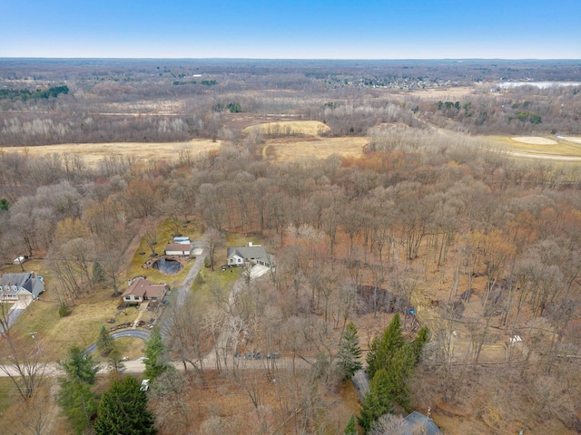 bird's eye view featuring a wooded view