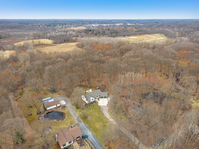 bird's eye view featuring a wooded view