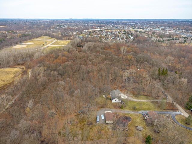 aerial view featuring a wooded view