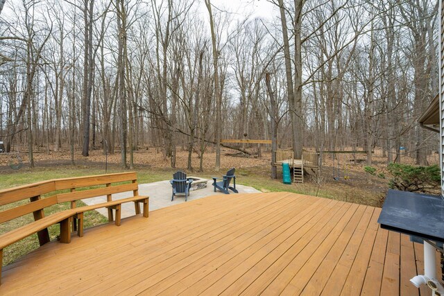 wooden deck featuring a fire pit