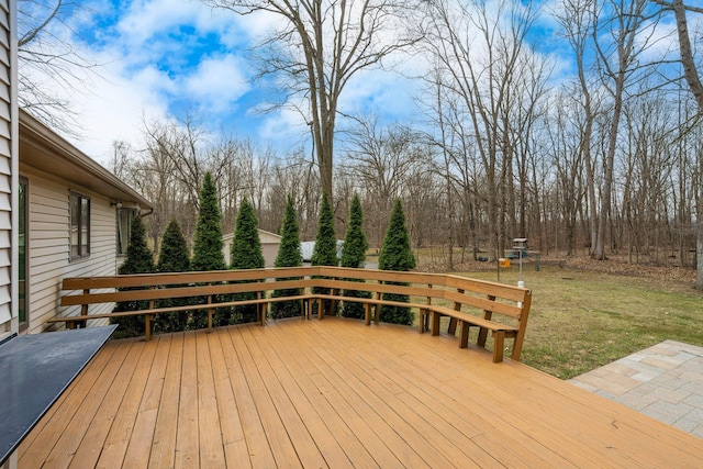 wooden deck with a lawn