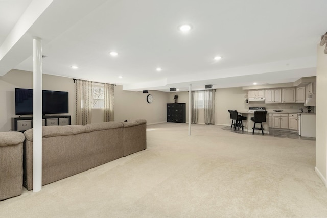 living room with light colored carpet and recessed lighting