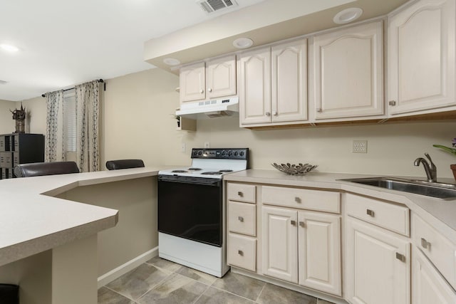 kitchen featuring under cabinet range hood, electric range oven, visible vents, a sink, and light countertops