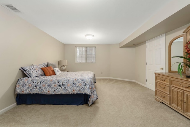 bedroom with light carpet, baseboards, and visible vents