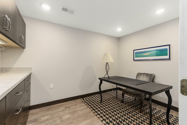 office area featuring light wood-type flooring, visible vents, baseboards, and recessed lighting