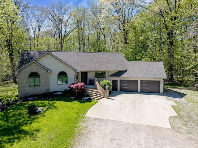 21395 Laser Ln, South Lyon, MI 48178 - view of front of house with driveway, a garage, a front lawn, and roof with shingles
