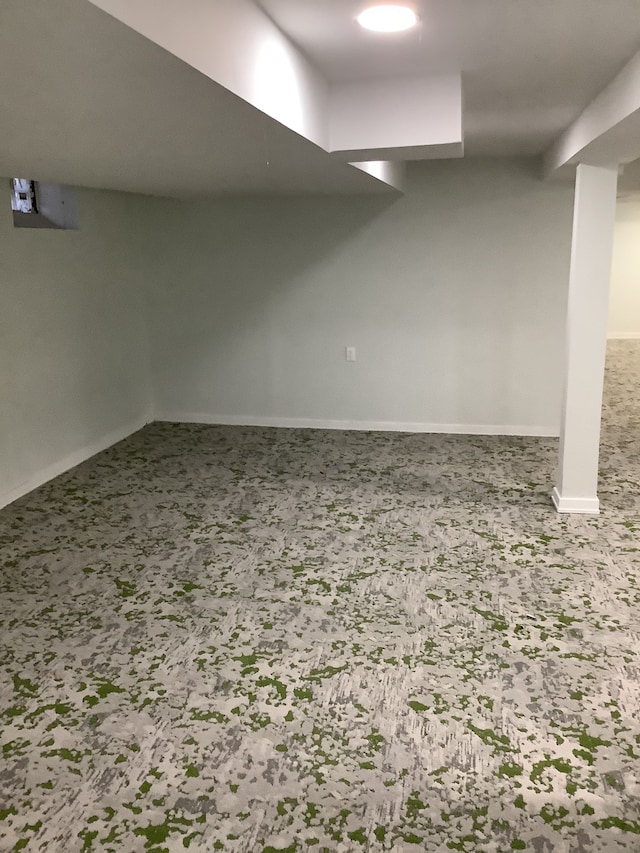 finished basement featuring carpet and baseboards