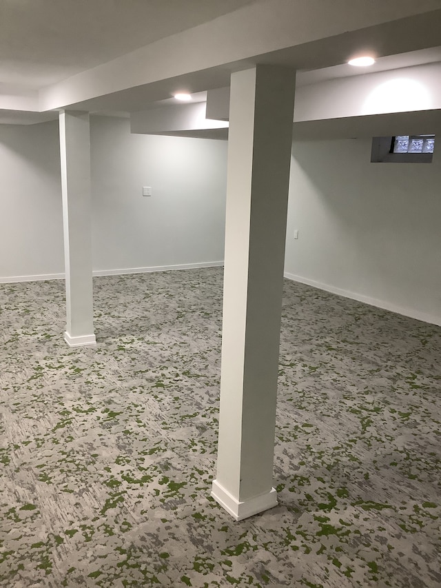 finished below grade area with baseboards and carpet