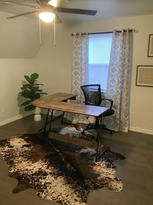 home office with a ceiling fan and baseboards