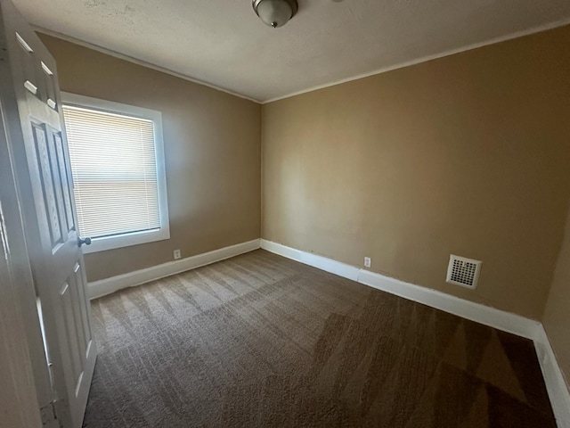 19980 Hickory St, Detroit, MI 48205 - unfurnished room featuring dark colored carpet and crown molding