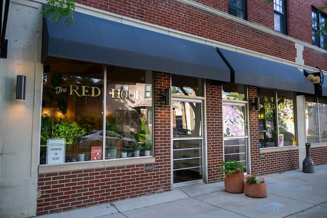 property entrance with brick siding
