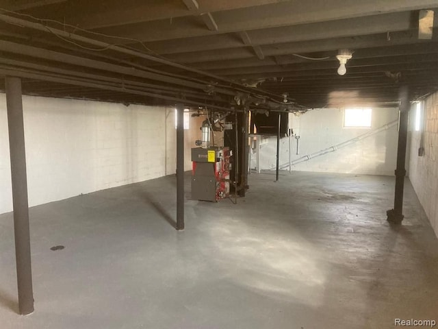 basement featuring a heating unit