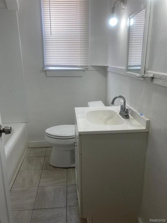 full bathroom featuring vanity, walk in shower, toilet, and a bathtub