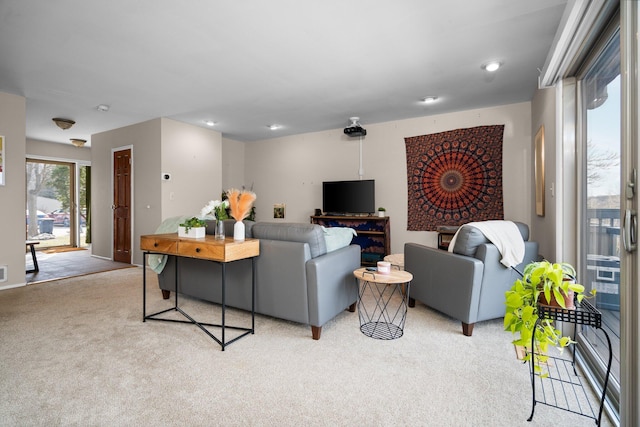 living room featuring light carpet