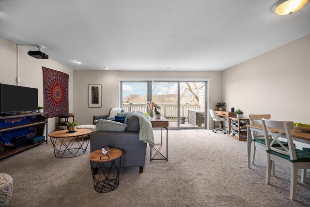 living area featuring carpet