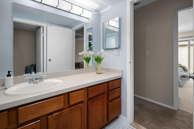 bathroom featuring vanity and baseboards