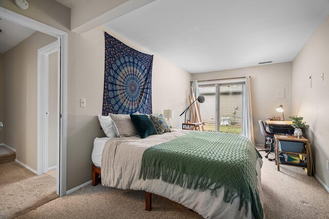 carpeted bedroom with baseboards and visible vents